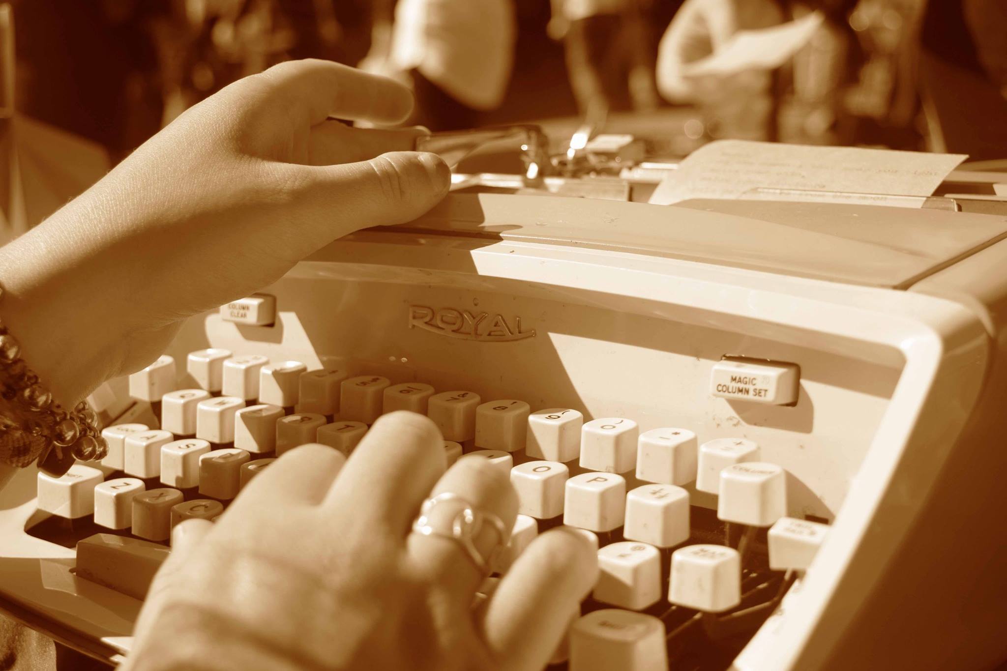 hands using a typewriter