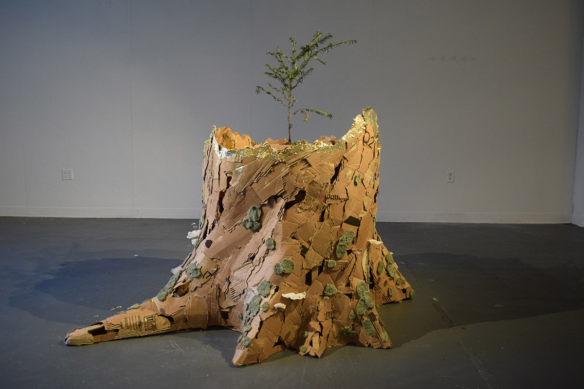 tree stump made of cardboard and other materials