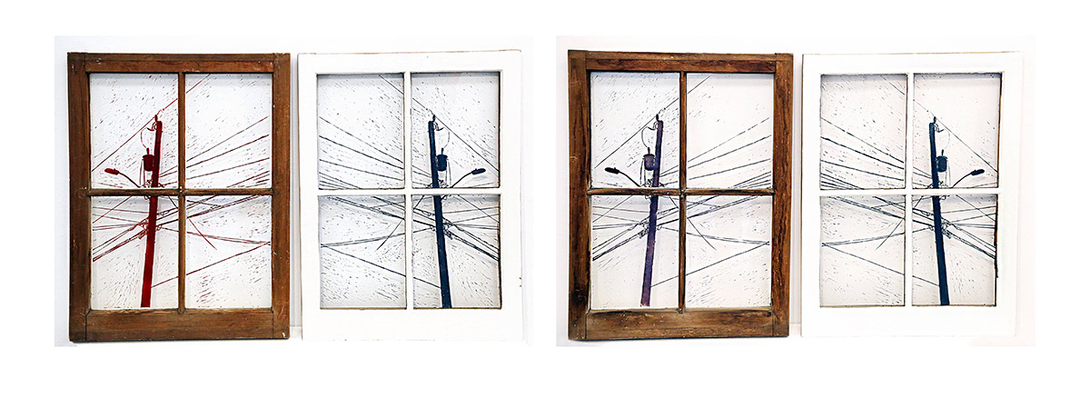four windows divided into four panes each. First and third window are bare wood frames, second and forth are white. Inside the panes is a painting or illustration of a utility pole with many wires extending form it.