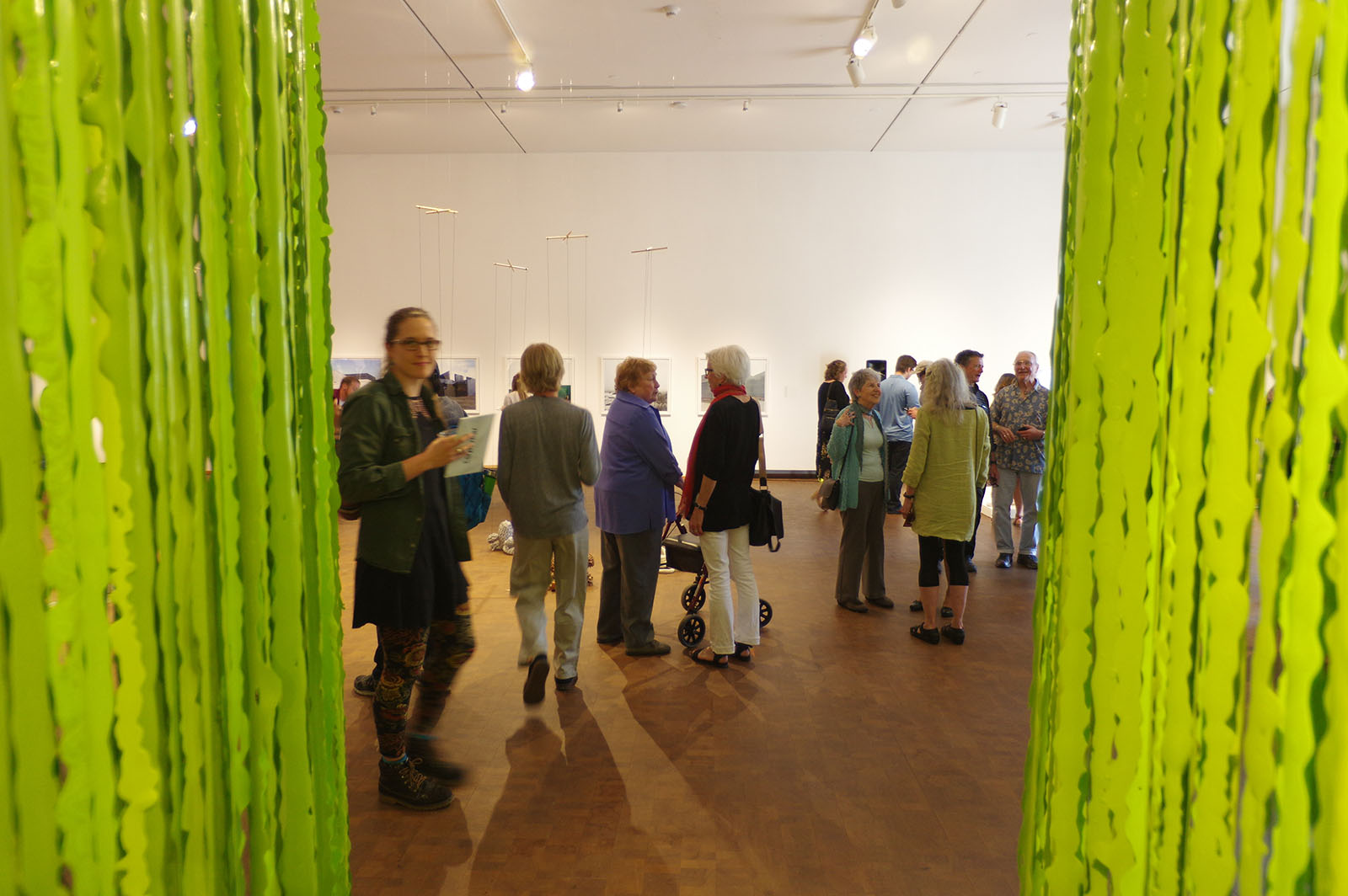 a group of people at a gallery reception