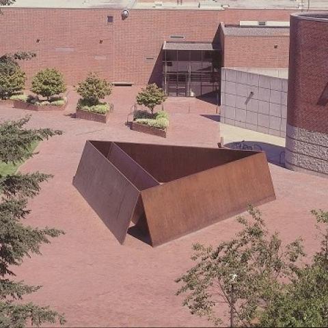 Richard Serra's sculpture Wright's Triangle in front of the Fine Arts and Ross Engineering buildings. Full description in body text.