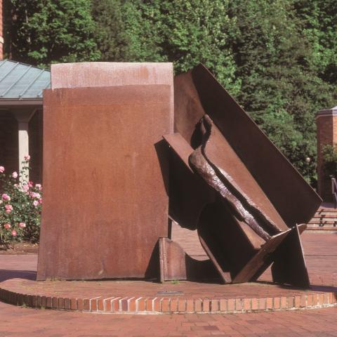 Anthony Caro's sculpture India next to the Old Main building. Full description in body text.