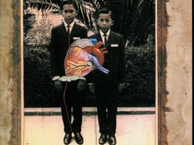 manipulated black and white photo of two young boys in suits looking very serious. There is a colorful anatomical heart superimposed over them.