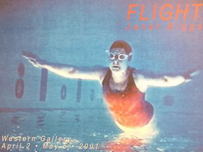 person in swimsuit, goggles, and swim cap is either floating above, diving into, or sinking below the water. The orientation and color of the image makes it difficult to tell which.