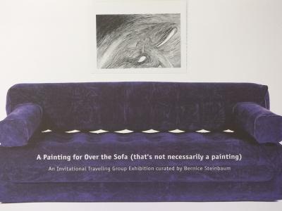 large purple sofa with a balck and white abstract drawing on the wall behind