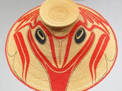 woven coast salish hat with red and black designs