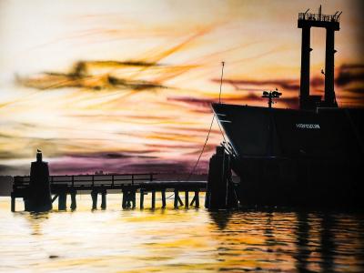 orangey streaked sky, a pier, silhouette of a working boat