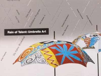colorful umbrellas being rained on by typed out names
