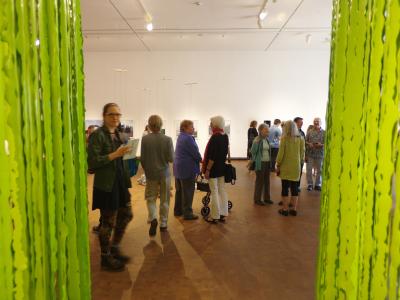 a group of people at a gallery reception