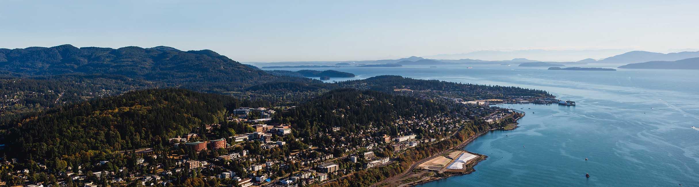 Aerial view of south Bellingham, the bay, islands, hills and mountains near Western Washington University campus